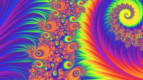 Rainbow Tentacle: every color of the spectrum across a full frame — a yellow-cored spiral upper right, a branching orange filament climbing left of center, and fanned bands of rays filling both sides.